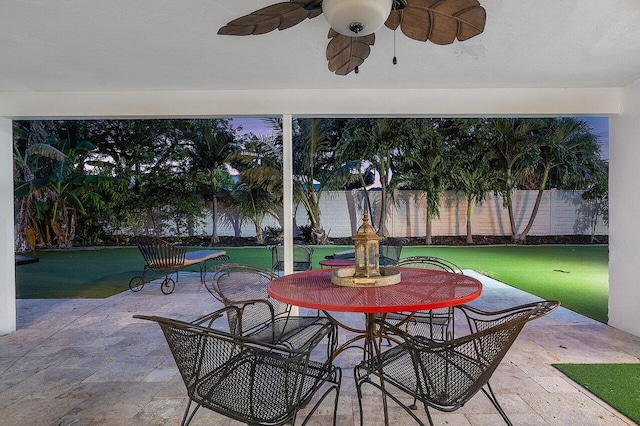 view of patio / terrace featuring fence and a ceiling fan