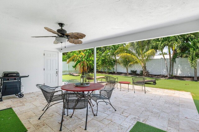 view of patio / terrace featuring ceiling fan and grilling area