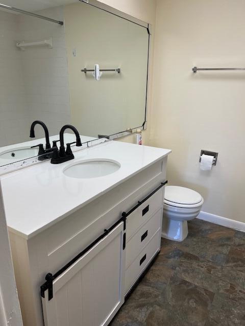 bathroom with vanity and toilet