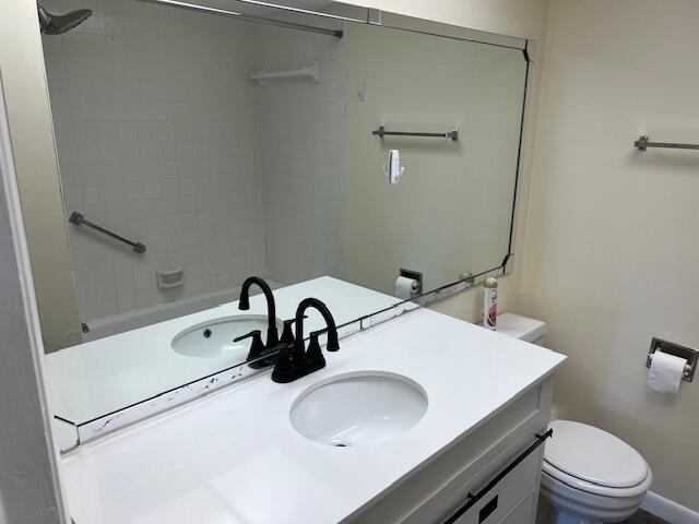 bathroom featuring vanity and toilet