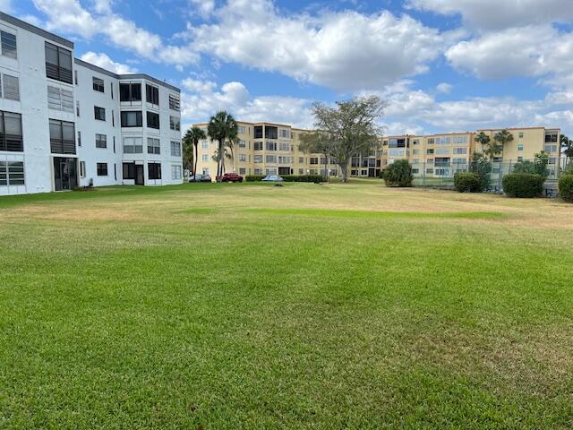 view of home's community with a lawn