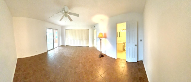 empty room featuring ceiling fan, a textured ceiling, and vaulted ceiling