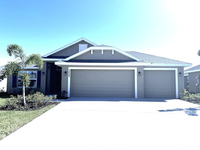 5482 Lugo St, Fort Pierce, FL 34951 - ranch-style house with a garage, stucco siding, and concrete driveway