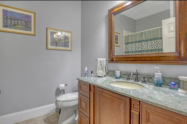 bathroom featuring vanity, tile patterned floors, and toilet