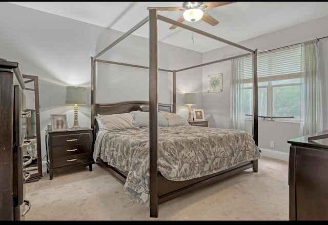 bedroom with light carpet and ceiling fan