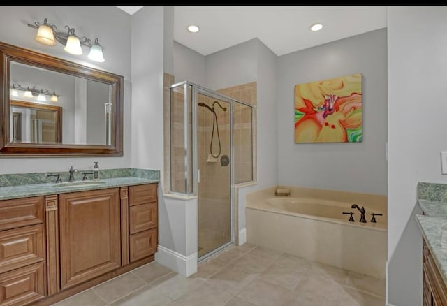 bathroom with vanity, tile patterned floors, and shower with separate bathtub