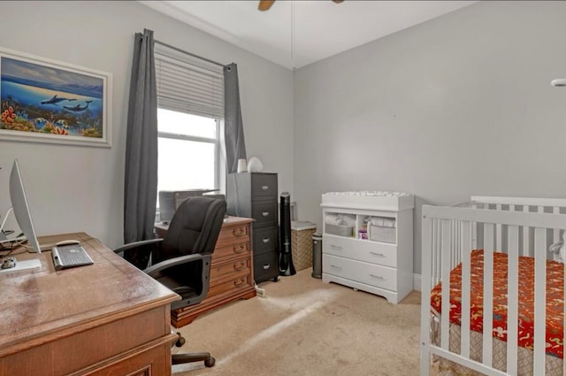 interior space featuring a nursery area and ceiling fan