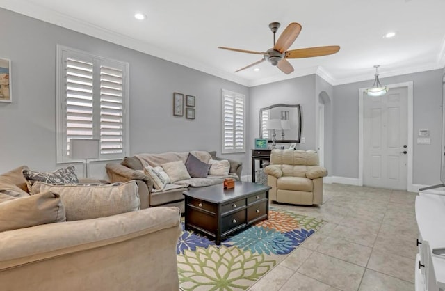 tiled living room featuring crown molding and ceiling fan