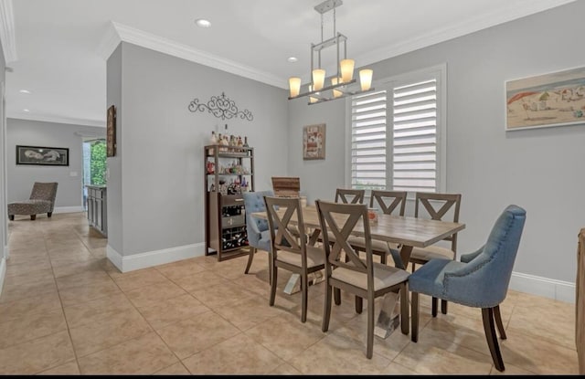 tiled dining room with an inviting chandelier and ornamental molding