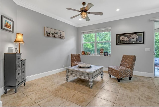 sitting room with light tile patterned floors, crown molding, and ceiling fan