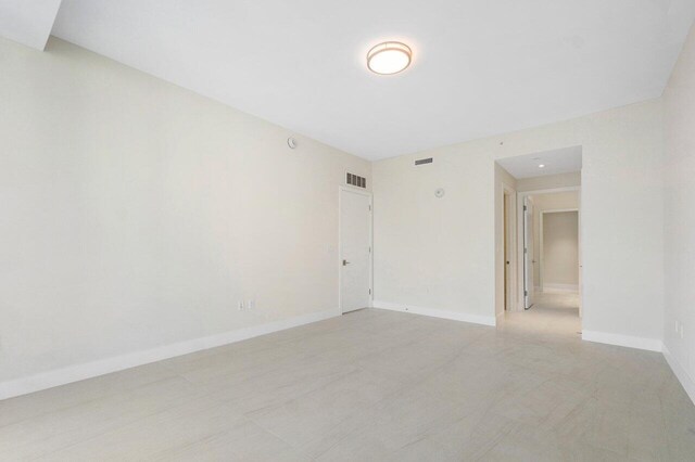 spare room with tile patterned flooring