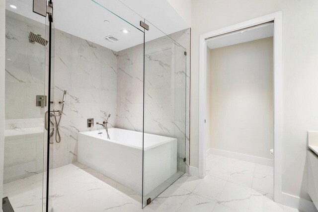 bathroom featuring dual vanity, an enclosed shower, tile patterned flooring, and toilet