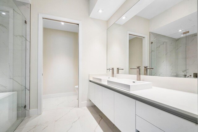 bathroom with tile patterned flooring, toilet, and vanity