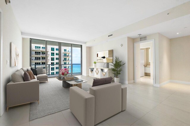 unfurnished room with light tile patterned flooring and a wall of windows