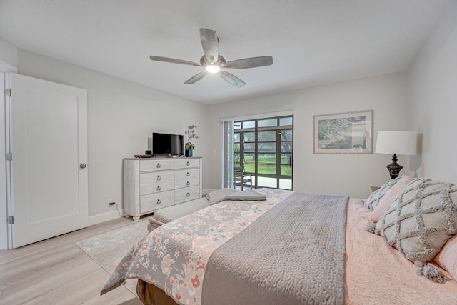 bedroom featuring access to exterior, light wood-type flooring, and ceiling fan