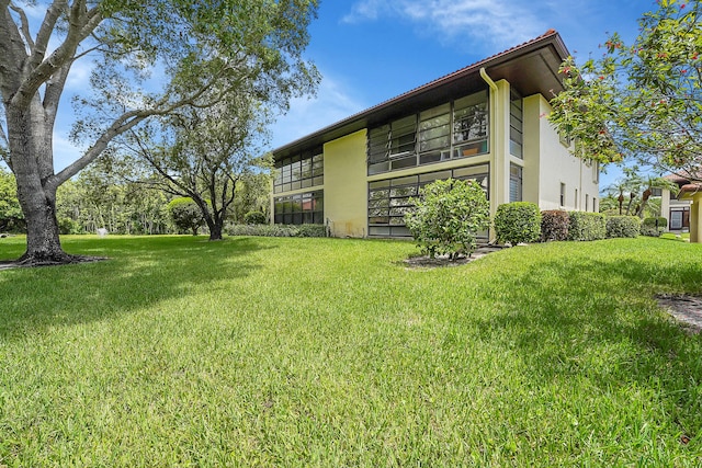 exterior space with a yard