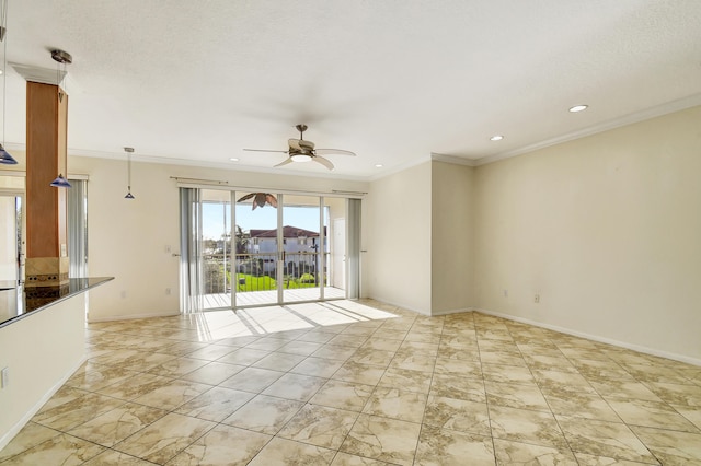 spare room featuring crown molding and ceiling fan