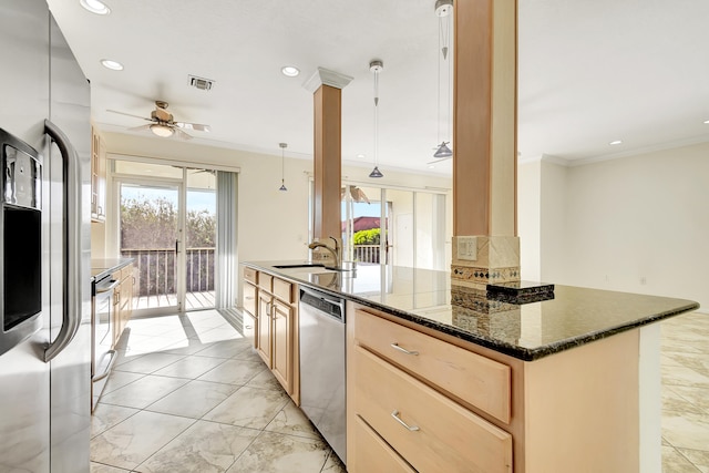 kitchen with decorative light fixtures, appliances with stainless steel finishes, sink, light brown cabinets, and ceiling fan