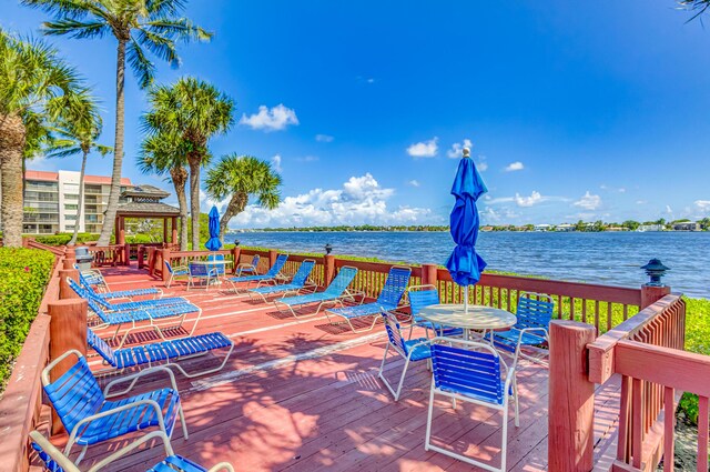 view of patio / terrace featuring a deck with water view