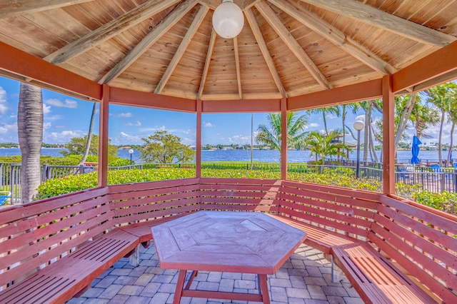 view of patio with a water view and a gazebo