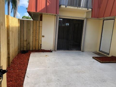 doorway to property with a patio area