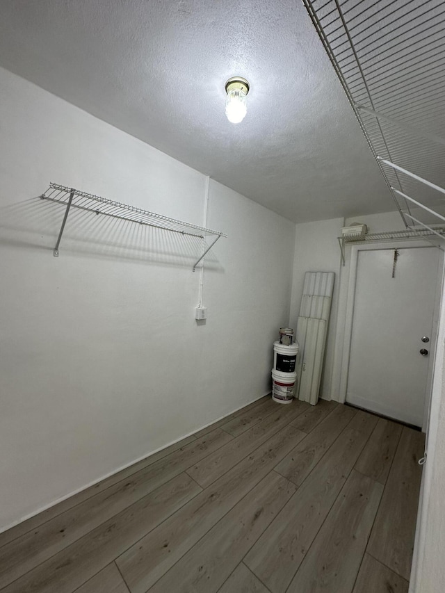 walk in closet featuring hardwood / wood-style floors