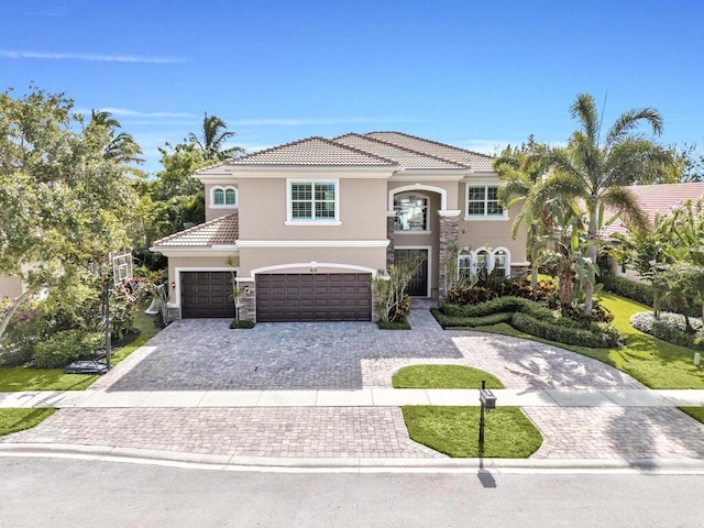 mediterranean / spanish-style home featuring a garage