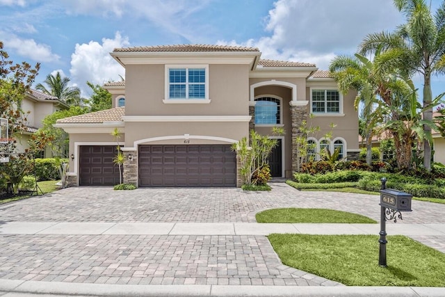 mediterranean / spanish-style home with a garage