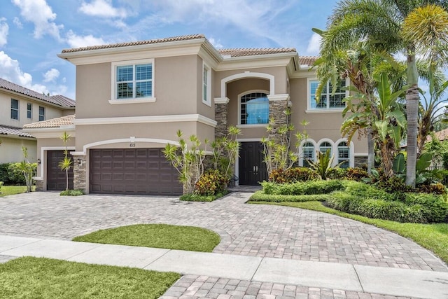 mediterranean / spanish house featuring a garage