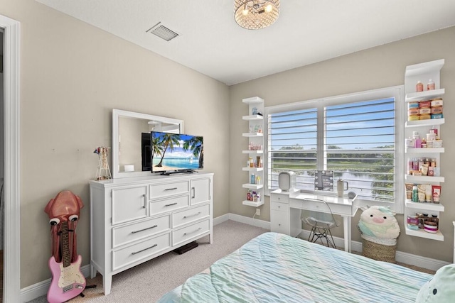 bedroom with light colored carpet