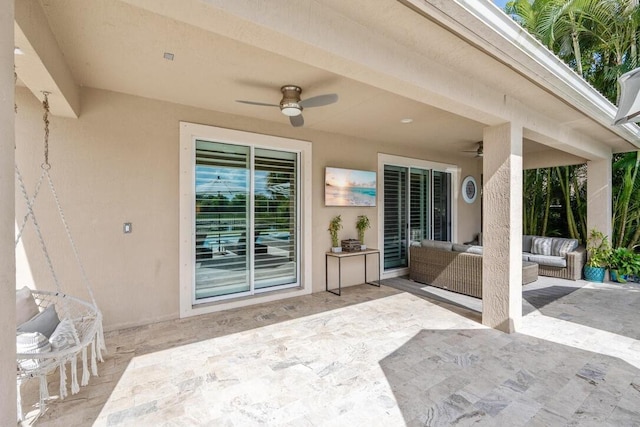 view of patio / terrace featuring ceiling fan and an outdoor living space