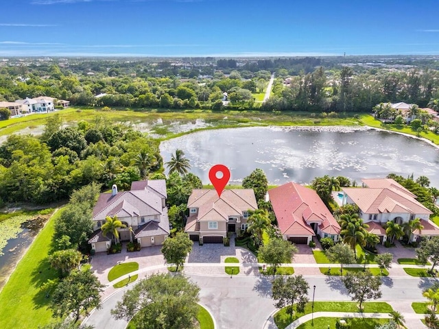 birds eye view of property featuring a water view