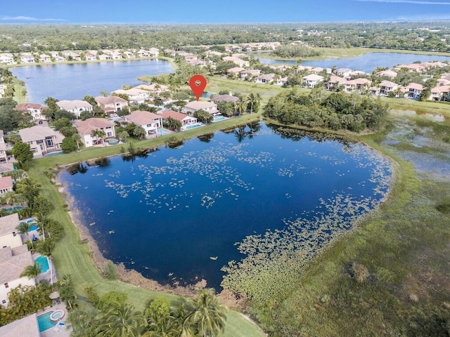 birds eye view of property featuring a water view