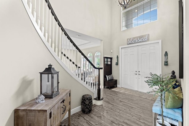 foyer featuring a high ceiling and light wood-type flooring