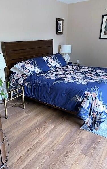 bedroom featuring hardwood / wood-style flooring