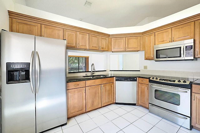 kitchen with sink and appliances with stainless steel finishes