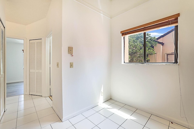 unfurnished room with light tile patterned floors