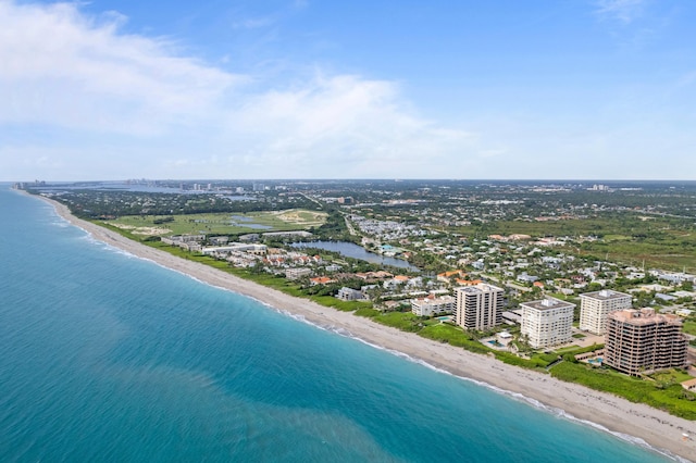 birds eye view of property featuring a water view and a view of the beach