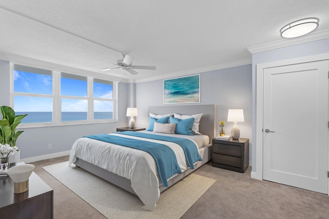 bedroom featuring crown molding, light colored carpet, a water view, ceiling fan, and baseboards