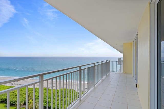 balcony with a view of the beach and a water view