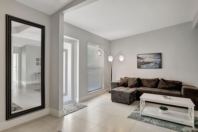 5278 NE 19th Ter, Pompano Beach, FL 33064 - living room featuring light tile patterned flooring and baseboards