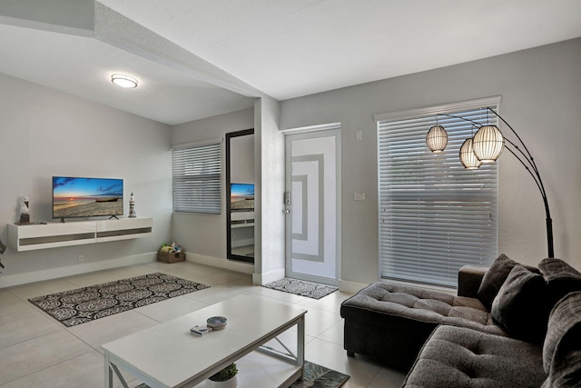 5278 NE 19th Ter, Pompano Beach, FL 33064 - tiled living area featuring baseboards and plenty of natural light