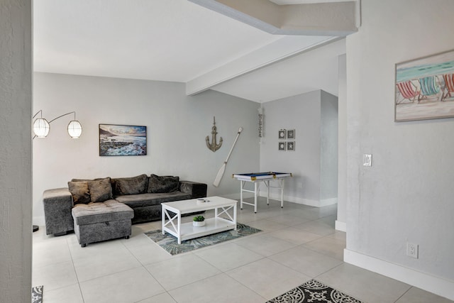 living room with light tile patterned flooring and lofted ceiling with beams