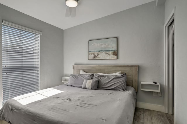 bedroom featuring hardwood / wood-style flooring and ceiling fan