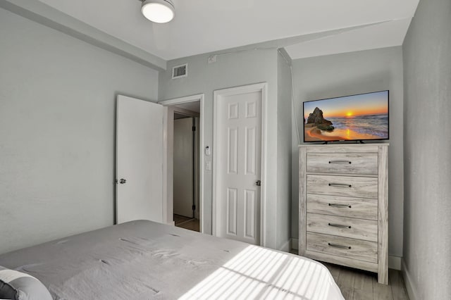 bedroom with wood-type flooring