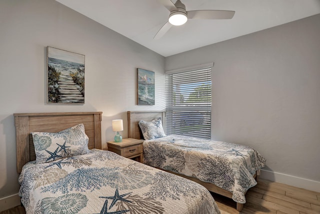 bedroom with ceiling fan and wood-type flooring