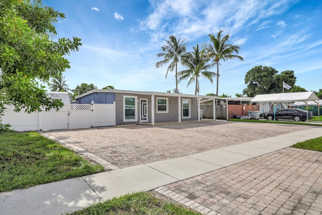 ranch-style home with a carport