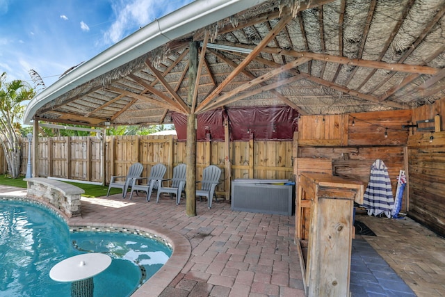 view of patio with a gazebo and a fenced in pool