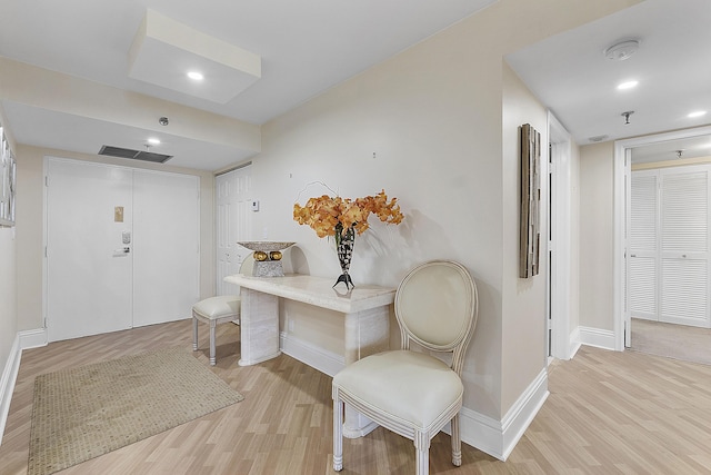 entryway with light wood finished floors, recessed lighting, visible vents, and baseboards