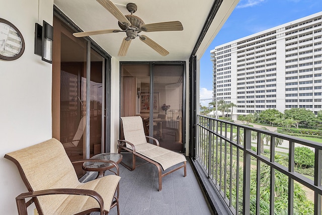 balcony with a sunroom and ceiling fan